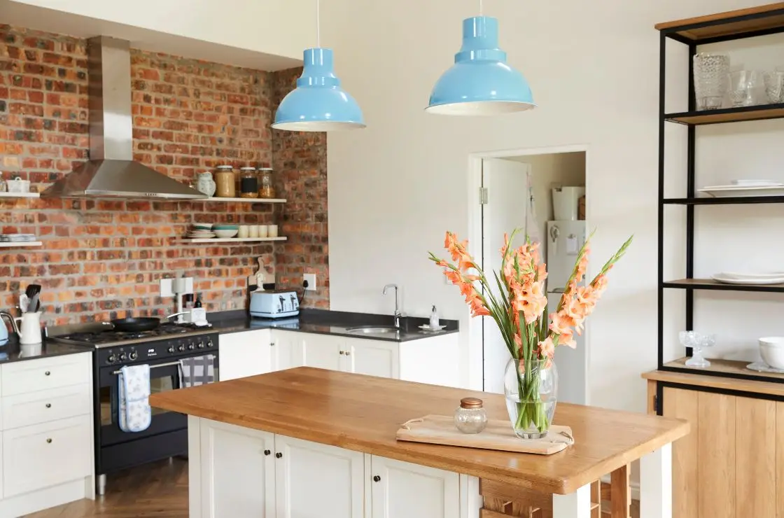 kitchen floor plan, view of nice kitchen with wood counter island and flowers