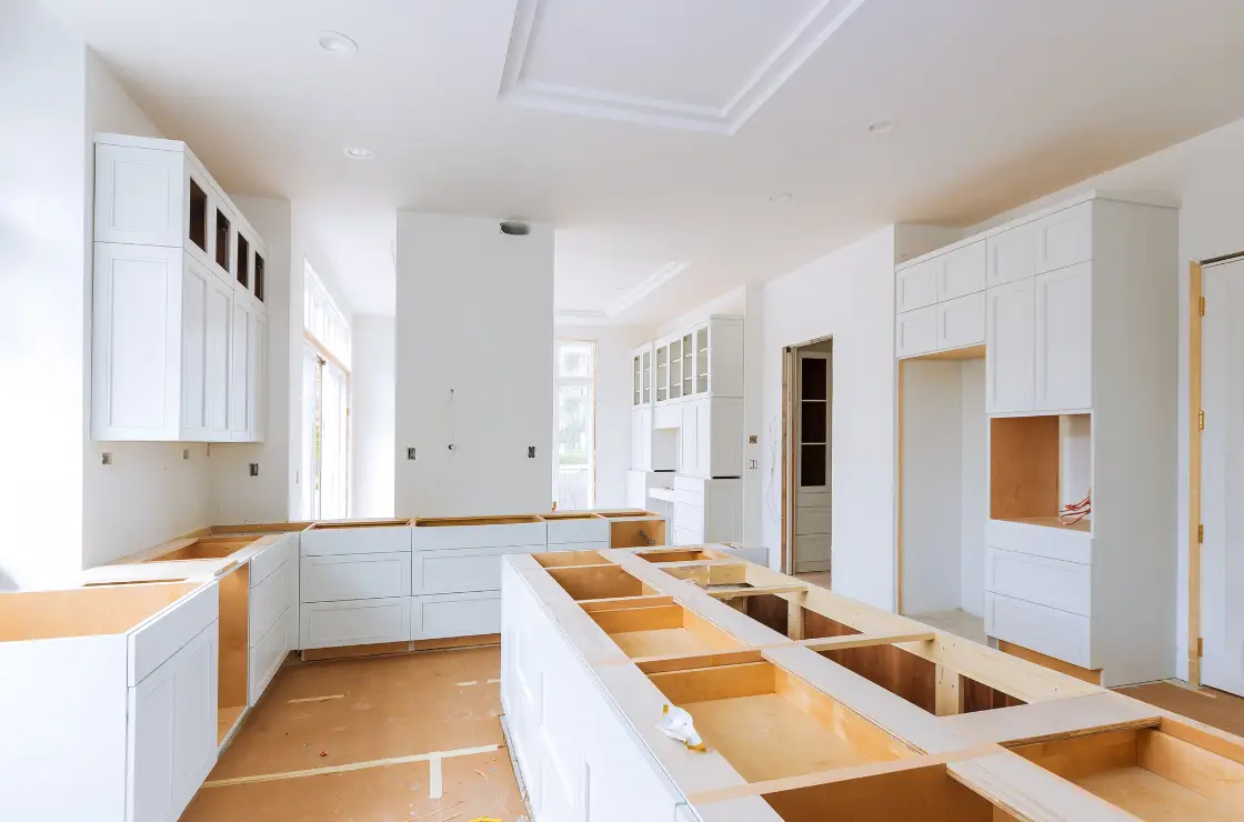 kitchen countertop installation - bright white kitchen missing countertops